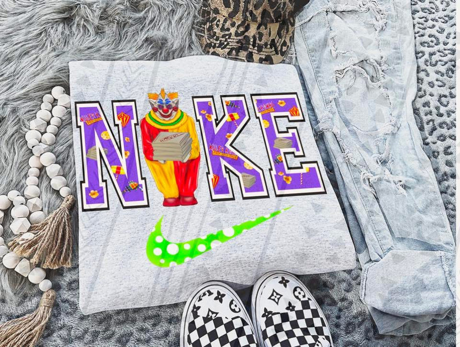 Creepy Clown Swoosh Graphic Tee – Horror Circus Knife Shirt – Gildan Adult & Youth Unisex – DTF Printed Halloween Shirt - Pretty Petty Co