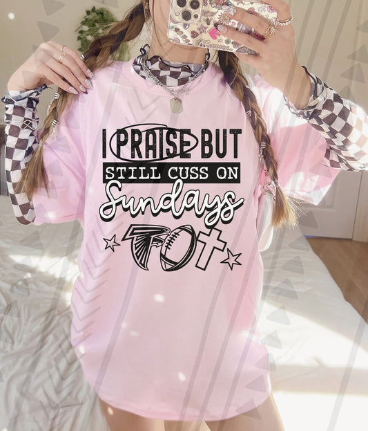 I Praise But Still Cuss On Sundays Football Shirt – Edgy Christian Sports Graphic Tee – Unisex DTF Print – Youth & Adult Sizes