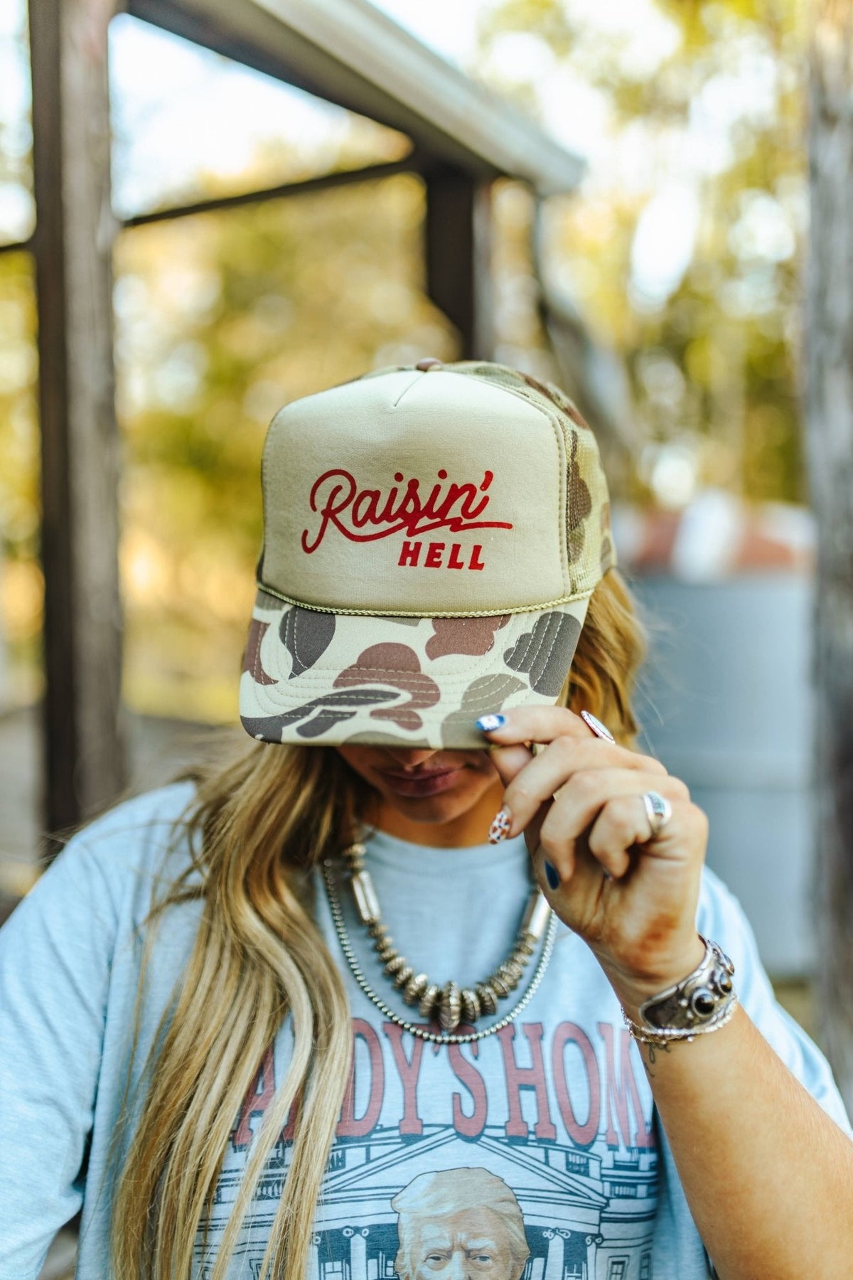 Raisin' Hell Green Camo Trucker Hat - Pretty Petty Co
