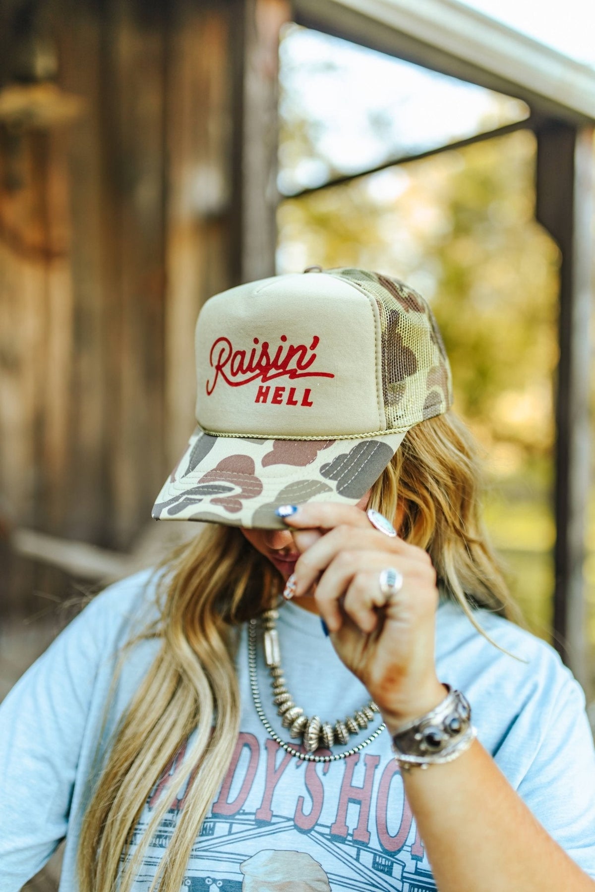 Raisin' Hell Green Camo Trucker Hat - Pretty Petty Co