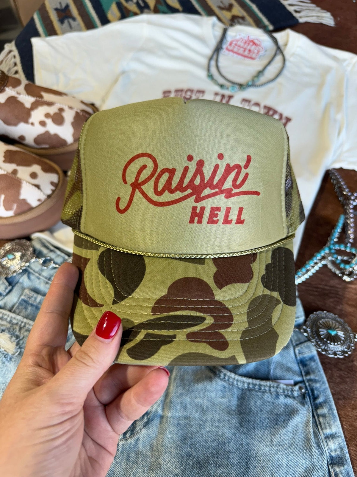 Raisin' Hell Green Camo Trucker Hat - Pretty Petty Co